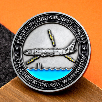 First P-8A 13B2 Aircraft military challenge coin featuring a P-8A Poseidon plane, submarine periscope, and lightning bolts.