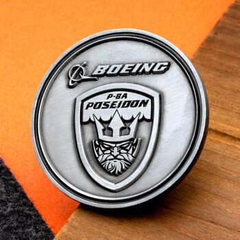 Antique silver challenge coin featuring the Boeing logo and P-8A Poseidon emblem.
