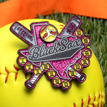 Custom softball lapel pin featuring a pink glitter Texas map, crossed bats, and small softballs on a yellow softball.