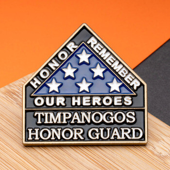 House-shaped lapel pin for Timpanogos Honor Guard featuring a folded flag with stars and the text 'Honor Remember Our Heroes'.