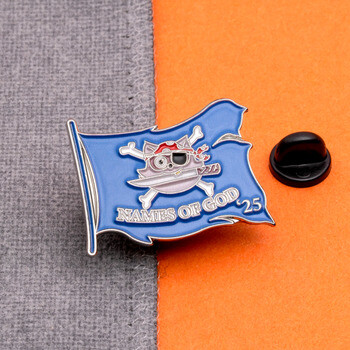 Blue flag lapel pin shaped like a tattered flag with a pirate cat skull and crossbones and Names of God 25 text.