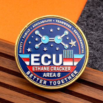 Blue and gold ECU Ethane Cracker Area 6 challenge coin with molecular structure and starry motif.
